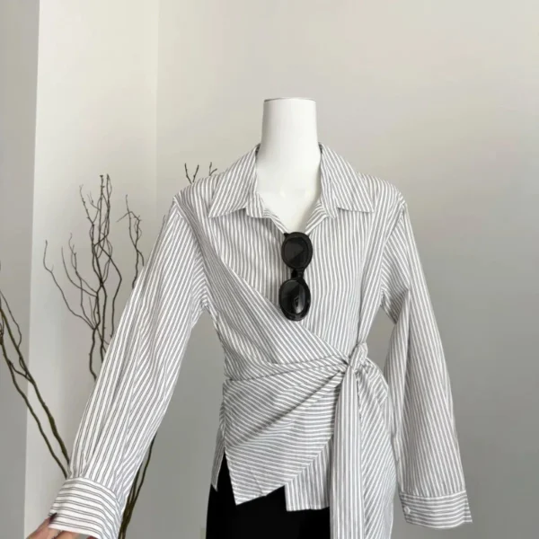 sg-11134201-7rd74-m6xr23ppj46z6a.webp Korean Style Waist Controlled Lace up Loose Striped Shirt Women Unique Elegant Long Sleeve Shirt Blouse Women